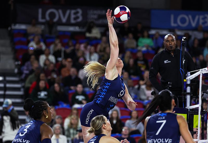 woman spiking volleyball